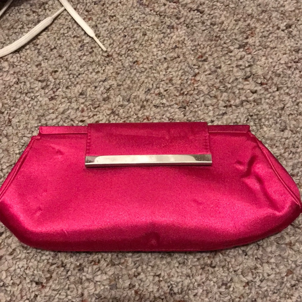 Brand new pink clutch with strap to make crossbody